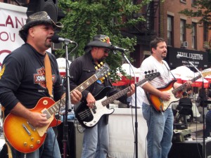 Joe Vincino and the Smokedaddys, a Long Island blues trio, performed on one of ten lives stages at the Antic.
